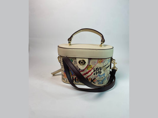 Front view of Coach EXNCAB bag on white background.