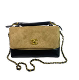 Front view of Chanel velvet bag on white background.